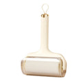 Load image into Gallery viewer, Beige handle sticky hair roller with transparent roller cover isolated on white background