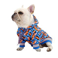 Load image into Gallery viewer, French Bulldog sitting calmly in colorful graphic hoodie with hood down