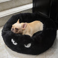 Load image into Gallery viewer, Black plush round pet bed with a small dog resting, showing the fluffy texture and facial embroidery