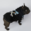 Load image into Gallery viewer, Top-angle view of French bulldog looking up wearing black artistic dog hoodie showcasing hood and back print