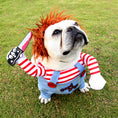 Charger l'image dans la visionneuse de la galerie, Close-up portrait of a small dog wearing Chucky costume with orange wig and holding a fake bloody knife