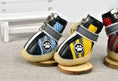 Load image into Gallery viewer, Side view showing the reflective strips and mesh panels on three dog boots in blue, yellow, and red