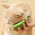Cargar la imagen en la vista de la galería, Beige and white cat enjoying being groomed with soft-touch green pet brush