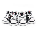 Load image into Gallery viewer, Front view of four red star print high-top dog shoes with white laces