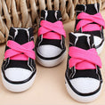 Charger l'image dans la visionneuse de la galerie, Black mini canvas dog sneakers with bright pink laces showing detailed stitching