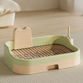 Cargar la imagen en la vista de la galería, Light green and peach indoor dog potty tray with metal grate and splash guard against wall