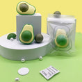 Load image into Gallery viewer, Two avocado catnip toys displayed with their catnip balls, one ball removed showing parts separately
