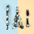 Load image into Gallery viewer, Green, blue, and orange geometric patterned dog collar laid flat on white background