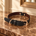 Cargar la imagen en la vista de la galería, Black croc-texture dog collar with rose-gold buckle on brown marble