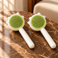 Load image into Gallery viewer, Pack of two green combs on brown marble