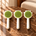 Load image into Gallery viewer, Pack of three green combs on brown marble