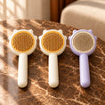 Load image into Gallery viewer, Pack of two yellow combs and one purple comb on brown marble