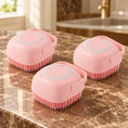 Load image into Gallery viewer, Three pink square silicone pet bath brushes on brown marble
