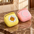 Load image into Gallery viewer, One pink and one yellow square silicone pet bath brush on brown marble
