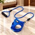 Charger l'image dans la visionneuse de la galerie, Blue mesh dog harness and matching rope leash with a black foam handle on light ivory-beige marble.