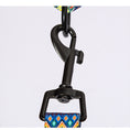 Load image into Gallery viewer, Close-up of black metal leash hook attached to blue and orange diamond patterned dog leash