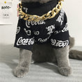 Load image into Gallery viewer, Gray cat wearing a black Coca-Cola shirt and big gold plastic chain necklace