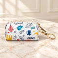 Cargar la imagen en la vista de la galería, White Forest Pouch with colourful animal illustrations and gold-tone clip