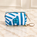 Cargar la imagen en la vista de la galería, Blue-and-white striped waste-bag pouch with blue dispensing port and gold-tone clip