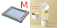 Load image into Gallery viewer, Medium-sized blue cooling pet bed mat with gray striped edges shown next to a beige and white pet water and food dispenser.