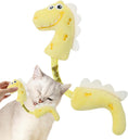 Load image into Gallery viewer, White cat playing with a yellow plush dinosaur chew toy held by a person