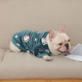 Load image into Gallery viewer, French bulldog lying on wooden floor wearing dark green plush pajamas with cow cartoon print