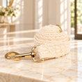 Charger l'image dans la visionneuse de la galerie, Coiled cream leaf-lace dog leash with gold swivel clasp on ivory marble