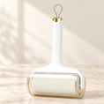 Load image into Gallery viewer, White lint roller with clear cover and grey hanging loop on ivory marble
