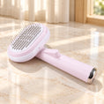 Load image into Gallery viewer, Pale pink steel-pin pet grooming brush with oval head and silver handle end