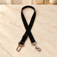 Load image into Gallery viewer, Black adjustable pet car tether on a cream marble entryway console
