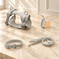 Charger l'image dans la visionneuse de la galerie, Light Gray dog harness, collar, lead and bag holder arranged on beige marble