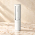 Load image into Gallery viewer, White reusable pet hair remover brush on an ivory marble surface