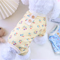 Load image into Gallery viewer, White dog wearing lightweight yellow floral breathable pajamas with wooden button details

