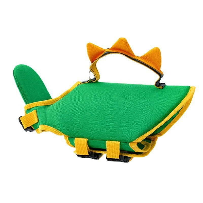 Green dinosaur-themed dog life jacket with yellow spikes on the handle and adjustable straps