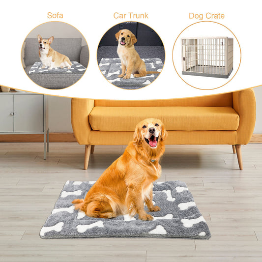 Golden retriever sitting contentedly on gray pet bed mat with white bone pattern in living room