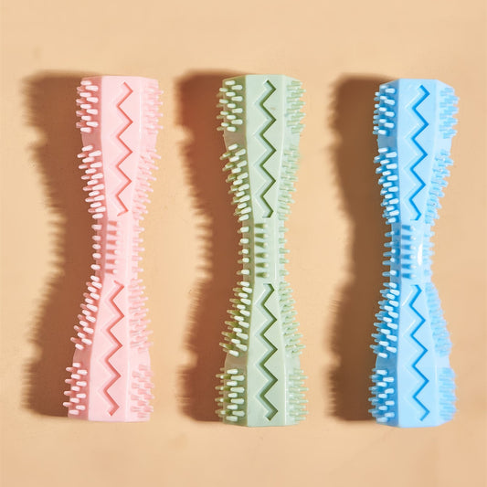 Three pastel-colored dog chew toys in pink, green, and blue with textured bristles and zigzag patterns
