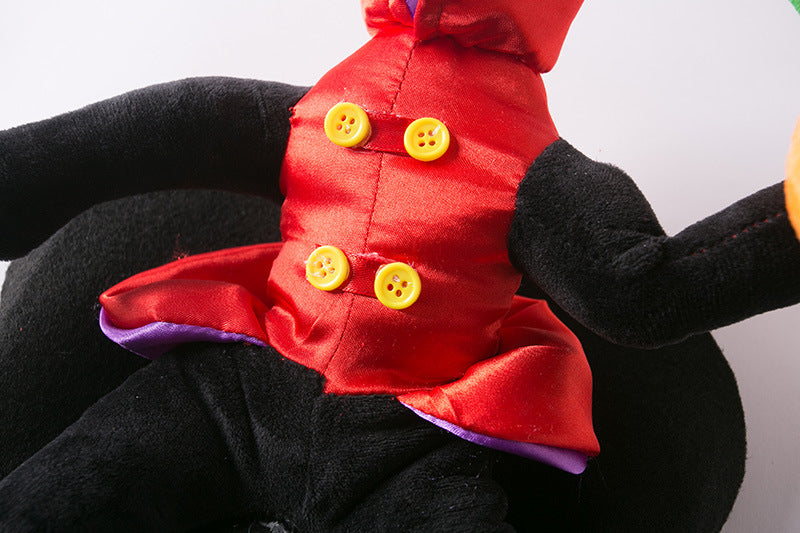 Close-up of red satin jacket with yellow buttons and plush pumpkin hand detail on the costume