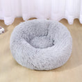 Load image into Gallery viewer, Light gray soft plush pet bed with high bolstered walls on light wooden floor under window
