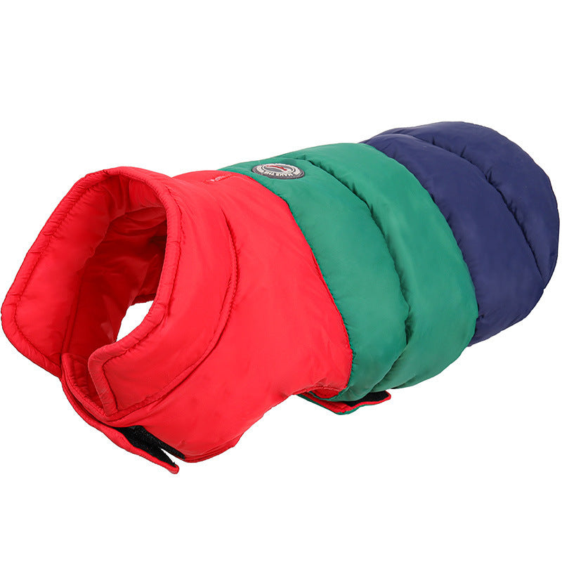 Close-up of red, green, and navy blue dog jacket padded with water-repellent fabric and velcro closure