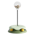 Load image into Gallery viewer, Close-up of green interactive cat treat toy with treat-filled clear container and yellow rolling balls
