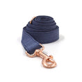 Load image into Gallery viewer, Rolled-up deep denim dog leash with rose gold snap hook
