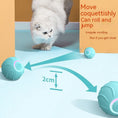 Load image into Gallery viewer, White cat playing with blue rolling ball demonstrating 2cm bounce height
