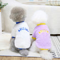 Load image into Gallery viewer, Two small dogs wearing Arizona fleece dog jumpers, one white with blue trim, the other lavender with yellow trim, sitting with backs facing camera
