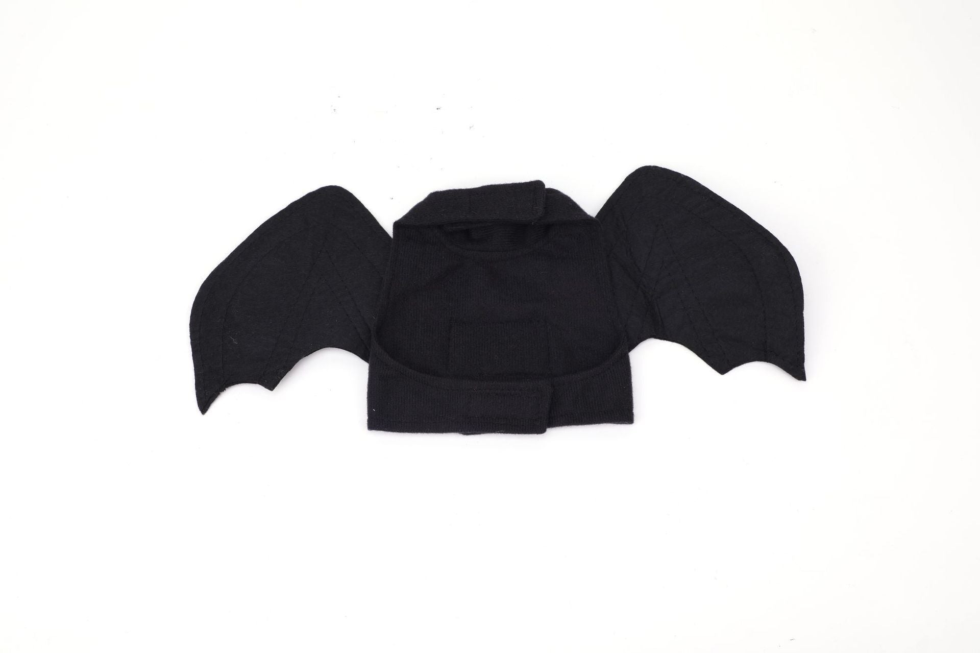 Close-up top-down view of black bat wing harness showing details of wing stitching and Velcro closure