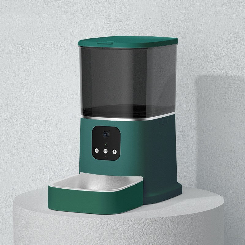 Green smart pet feeder on white round pedestal