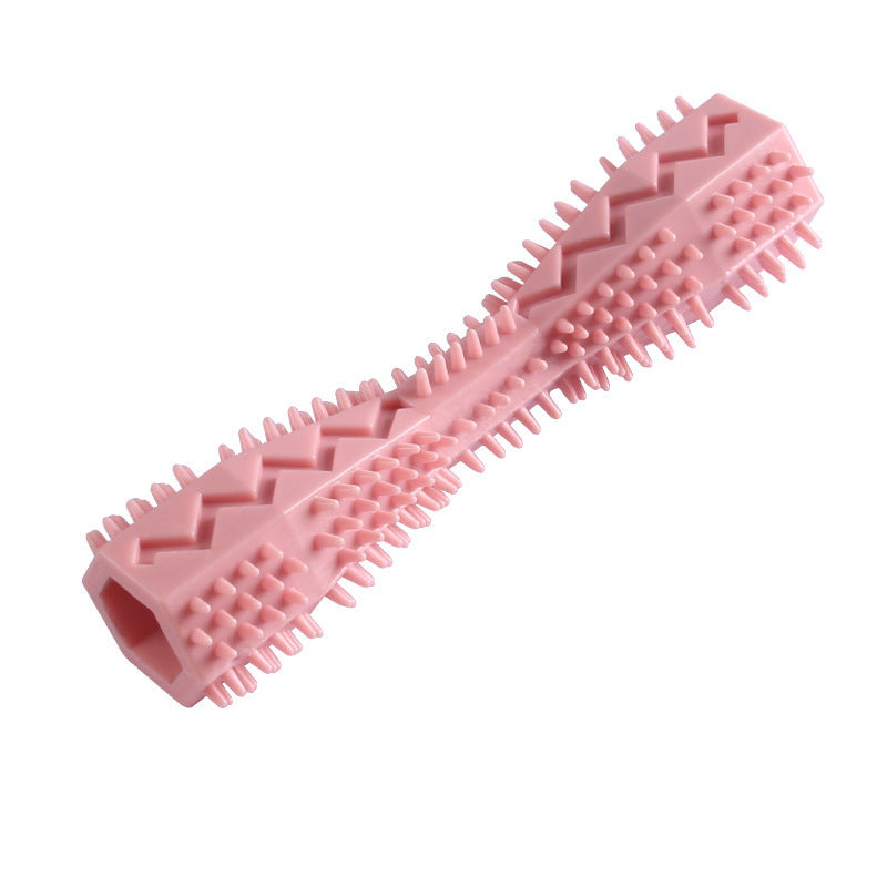 Pink, green, and blue durable dog chew toys arranged on white surface