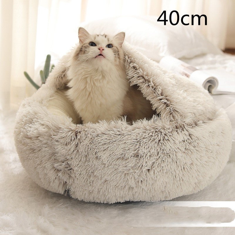 Close-up of cat in beige dome pet bed with 40 cm size label