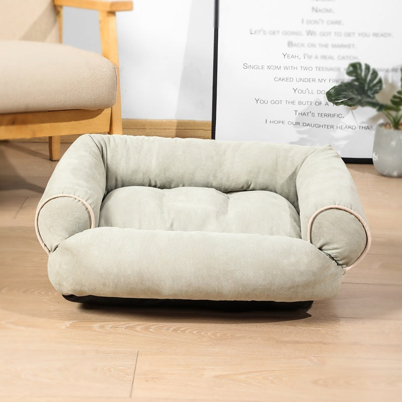 Soft light gray velvet pet sofa bed with raised padded sides for head support