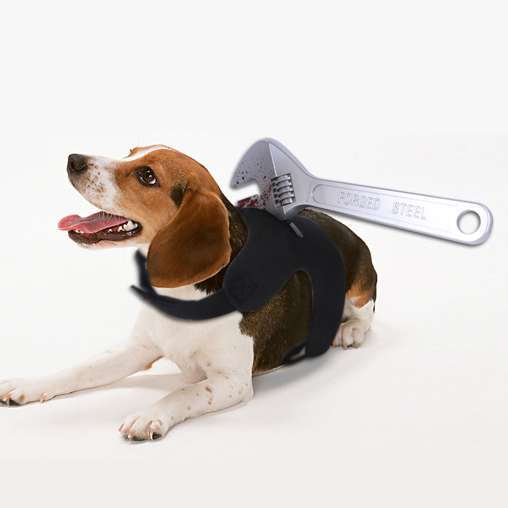 Beagle dog lying down wearing black harness with fake bloody adjustable wrench prop attached