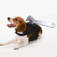 Load image into Gallery viewer, Beagle dog lying down wearing black harness with fake bloody adjustable wrench prop attached
